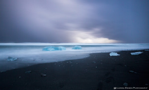 More icebergs getting washed around in the surf, Jokulsarlon, Iceland