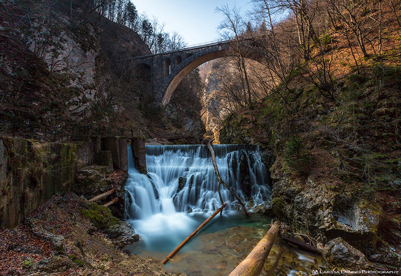 The beautiful train for the bridge with a waterfall damn below, Vintgar Gorge, Slovenia