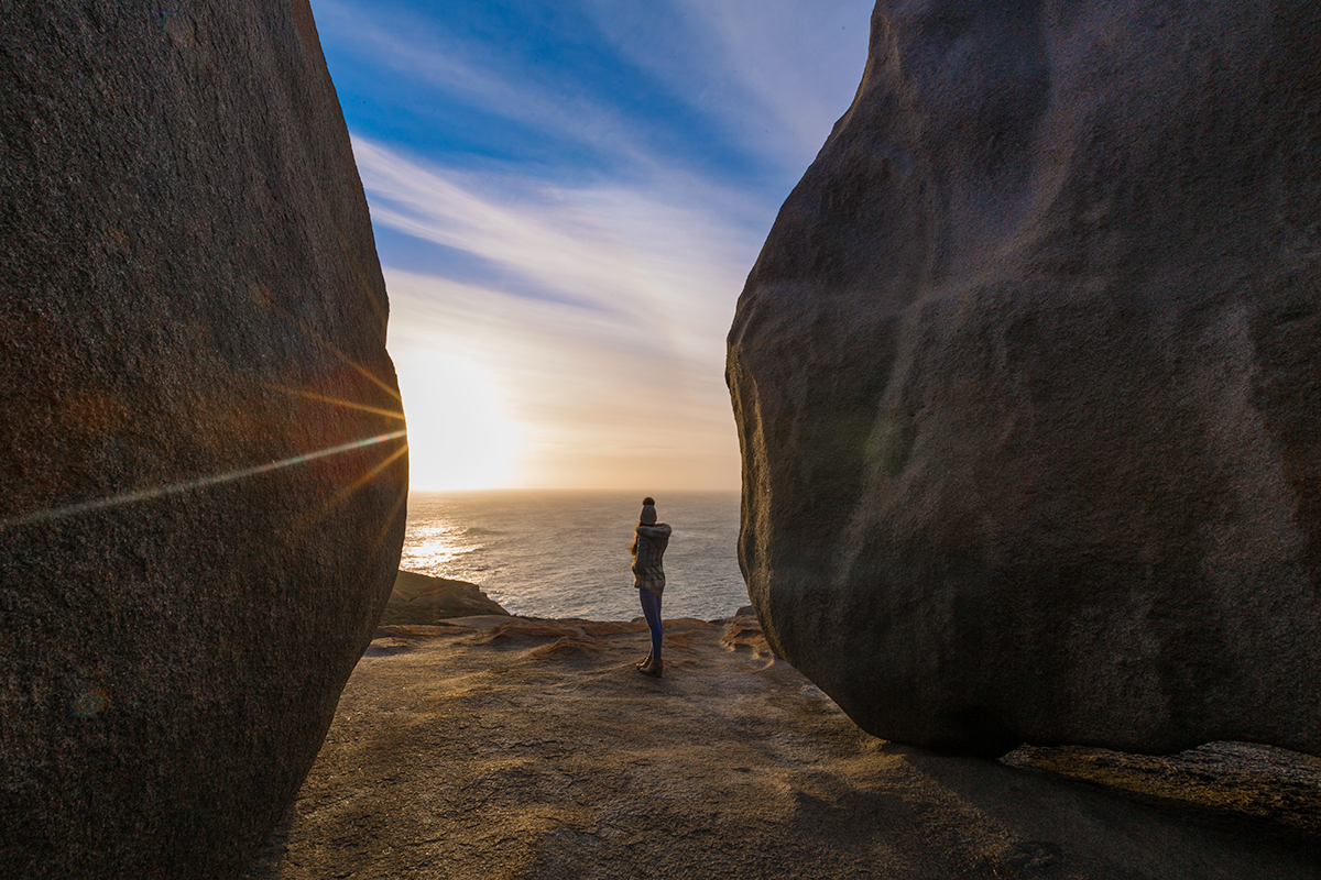 Standing between massive boulders watching the sun rise, Kangaroo Island