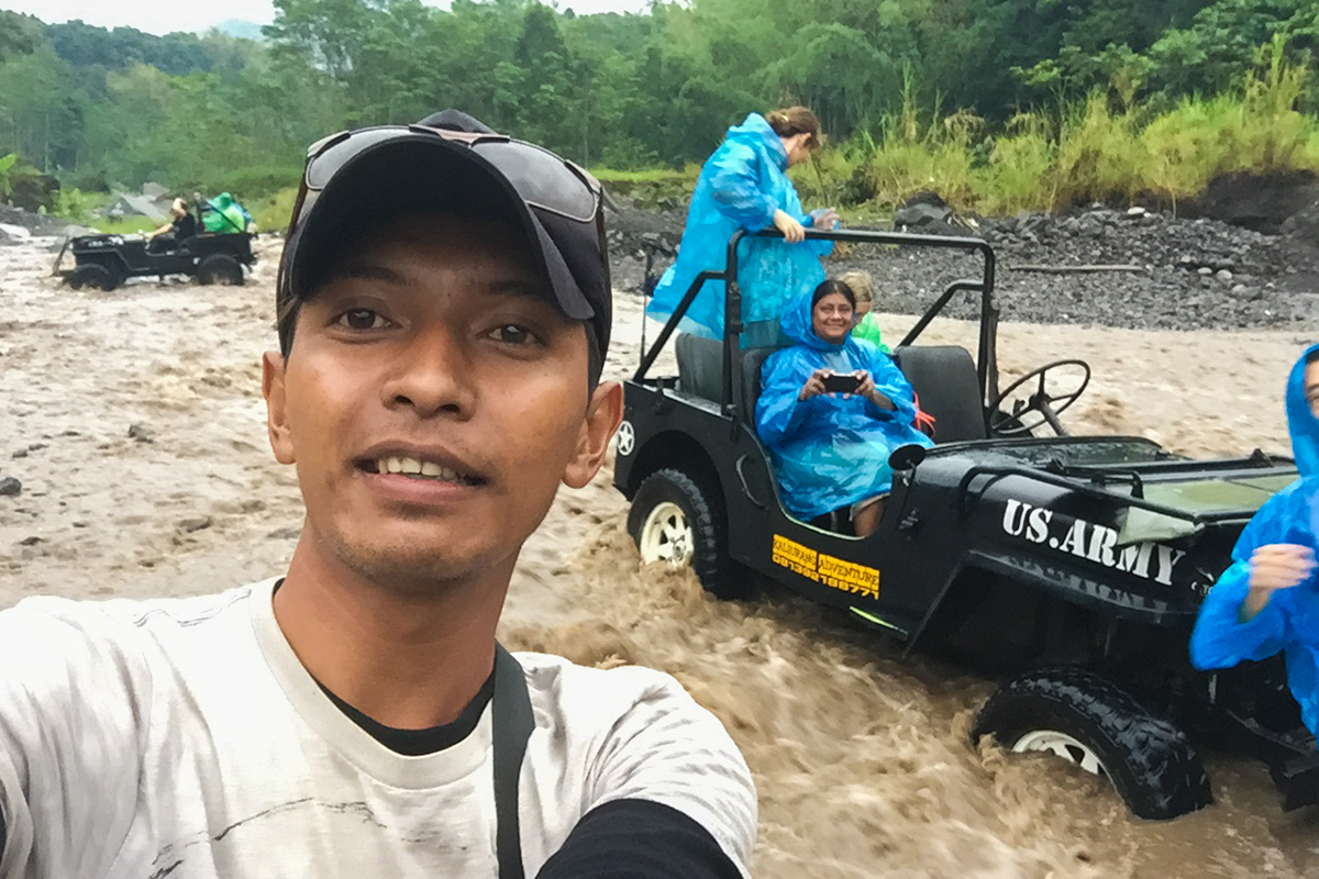 Our jeep driver taking selfies of us stuck in the river on my iPhone! Haha!