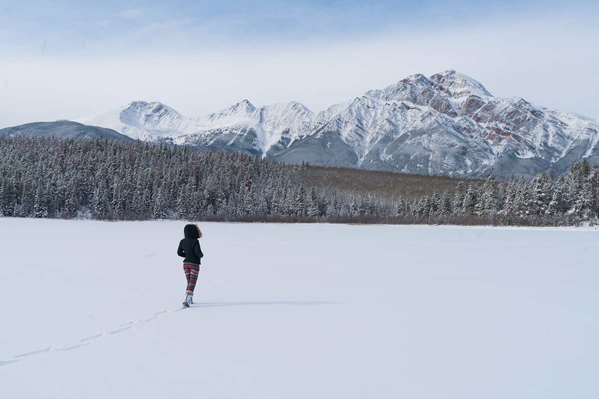Walking across a frozen Patricia Lake, Jasper National Park