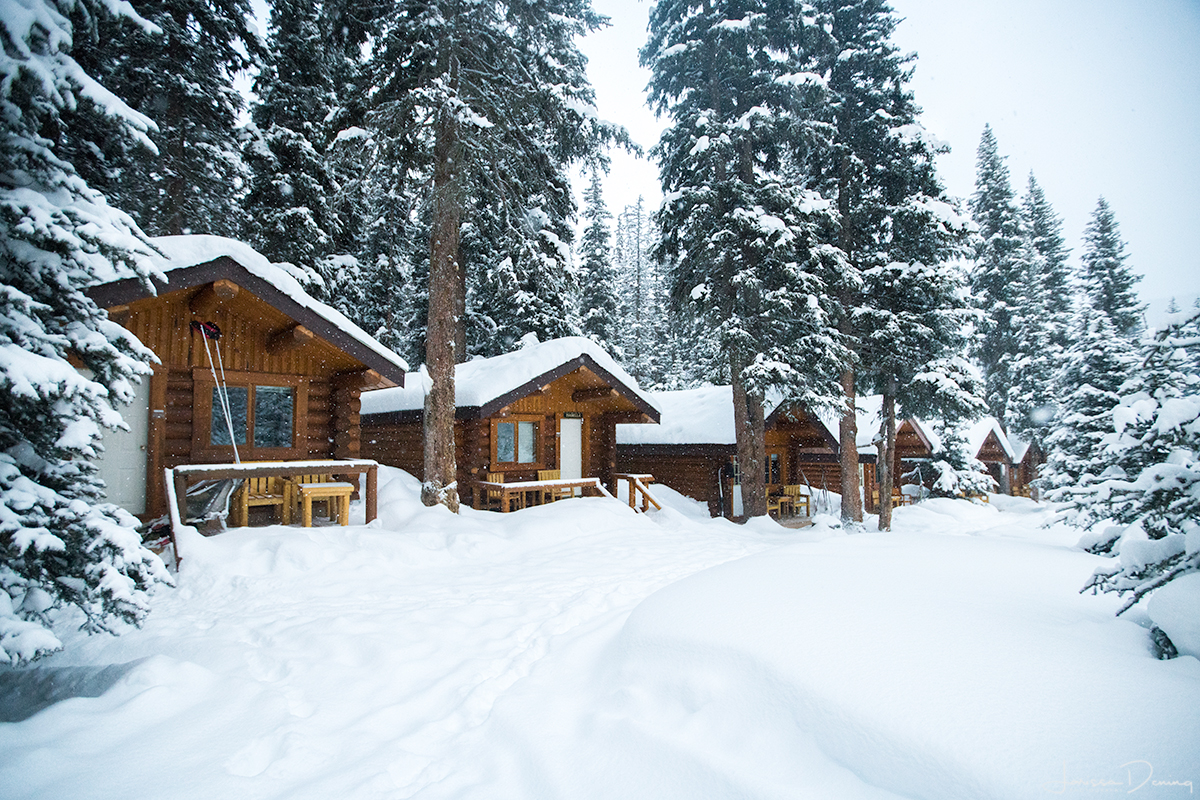 Log cabins covered in snow, Shadow Lake Lodge
